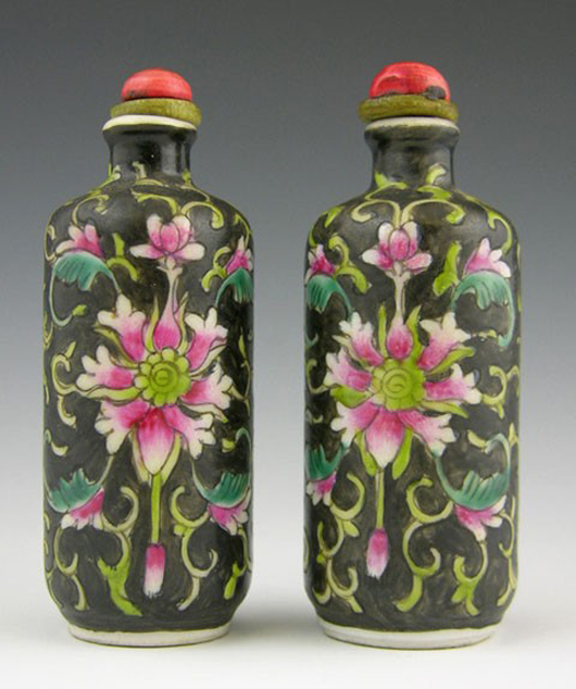 Pair of black cylindrical polychrome painted snuff bottles, early 20th century, est. $250-$450.