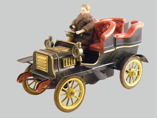 Circa-1904 Bing rear-entrance tonneau, hand painted with rubber tires, 8¼ inches long, $15,926. RSL Auction Co. image.