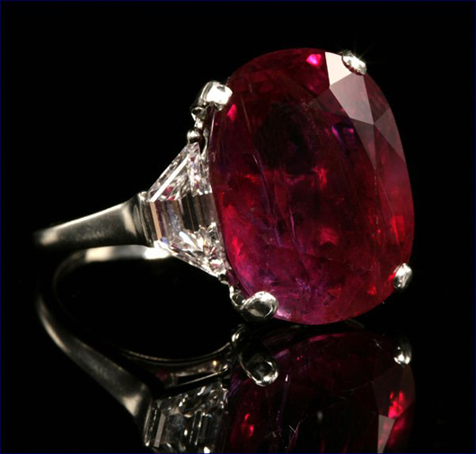 Supremely beautiful, Burmese rubies of the quality shown here are rare and desirable. This ring featuring an oval cut 22.25-carat ruby in a platinum setting with two trapezoid-shape diamonds sold for $276,000 (inclusive of 10% buyer's premium) in a Sept. 18, 2007 auction conducted by John Moran Auctioneers. Image courtesy of LiveAuctioneers.com archive and John Moran Auctioneers.