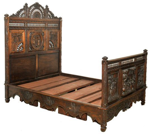French Provincial heavily carved oak bedroom suite, 19th century, composed of an armoire and full-size bed. Estimate: $8,000-$10,000. Image courtesy of Gray’s Auctioneers.