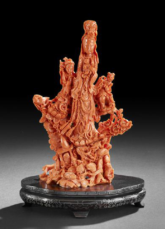 Elaborate Chinese carved coral group, first half 20th century, composed of a central figure of Guanyin holding a child and two attendant deities, 12 1/8 inches including fitted wooden stand. Estimate: $3,000-$5,000. Image New Orleans Auction Galleries Inc.