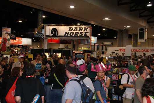 As seen here at Comic-Con 2010, in addition to visiting dealers in search of comic books, toys and other collectibles, attendees can also stop by the booths of comic book publishers, game manufacturers and movie studios to see the latest promotional items. Photo by Michael A. Solof.