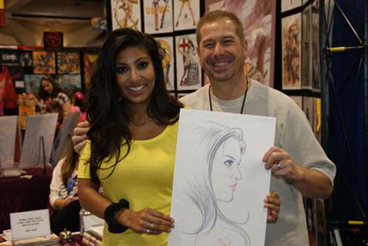 Comic-Con is a destination for local, national, and even international media. Kaushal Patel, a news anchor at San Diego’s Fox affiliate, Fox 5, stopped by Comic-Con 2010, where she met Sgt. Rock writer-artist Billy Tucci, who immediately whipped up a sketch of her. Photo by Michael A. Solof.