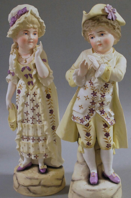 Pair of Continental painted bisque 18th century-style fancy dressed boy and girl figures, 17 1/4 inches. Estimate $200-$300. Image courtesy of Skinner Inc.