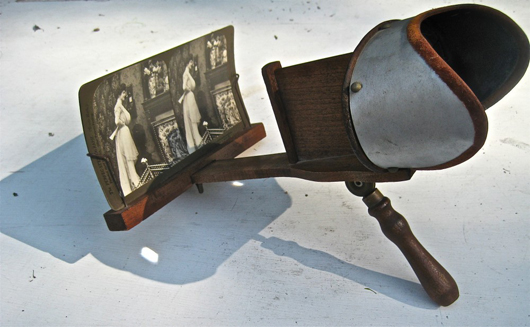 Cindy's personally owned stereoscope, with a card promoting a new invention—the telephone.