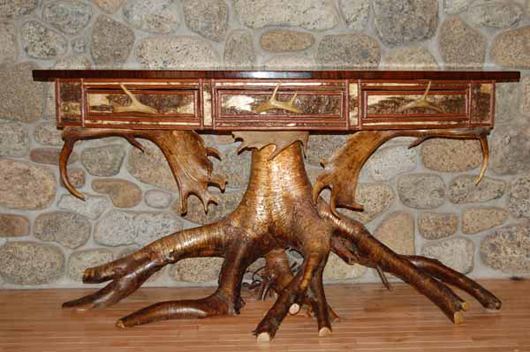 George Jacques bow-front, root and antler base console table with curly maple top, est. $4,000-$6,000. Image courtesy of Blanchard's Auction Service.