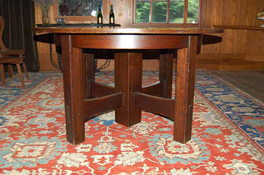 Signed Gustav Stickley oak dining table with five leaves, est. $15,000-$25,000. Image courtesy of Blanchard's Auction Service.