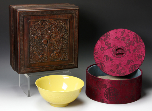 Chinese 18th-century yellow glazed bowl, Yongzheng Period (1723-1735), in original silk-covered box set inside a carved wood box. Estimate: $40,000-$60,000. Image courtesy of Kaminski Auctions.