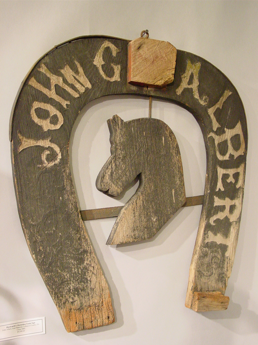 Antique blacksmith sign from Steven F. Still Antiques. Archival photo copyright Catherine Saunders-Watson.