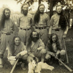 1928 photo of one of the greatest House of David baseball teams, with their canine mascot who traveled with them. Front, left to right: Mud Williams, Horrace Hannaford, George Anderson. Back: Dave Harrison, Percy Walker, Tom Dewhirst and Bob Dewhirst. Percy Walker signed a baseball bat along with Babe Ruth that year stating he was the only one who had ever struck out Ruth twice in one game. Image courtesy of House of David Museum.