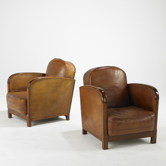 Pair of 1930s Art Deco club chairs, USA; beech, lether and brass, $700-$900. Rago image.