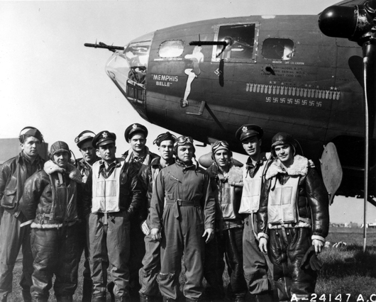 The crew of the B-17 Flying Fortress Memphis Belle is shown at an air base in England after completing 25 missions. Capt. Robert K. Morgan (fifth from left) was the pilot. Image courtesy of Wikimedia Commons.