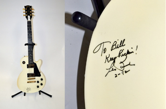 Signed Les Paul Gibson ivory electric guitar, dated ‘2-92.’ Estimate: $2,500-$3,500. Image courtesy of Roland Auctions.
