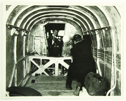 In a photo taken by a personal friend, Earhart poses for a press photographer inside the Lockheed Electra 10E. Image courtesy of Clars Auction Gallery.