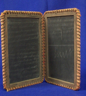 The double slate used by pupils in the early 1900s is the old-school version of today’s laptop. Image courtesy of LiveAuctioneers Archive and Williams Auction and Appraisal Service.