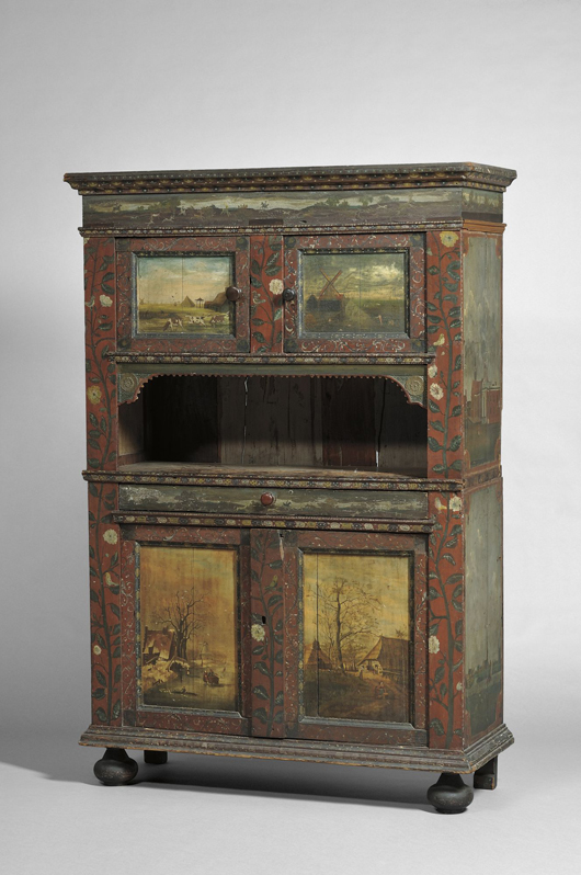 Dutch polychrome painted cupboard, 19th century and later, the molded pediment with panoramic scene of a stag hunt, 78 3/4 inches high, 53 inches wide, 20 1/2 deep.</p srcset=