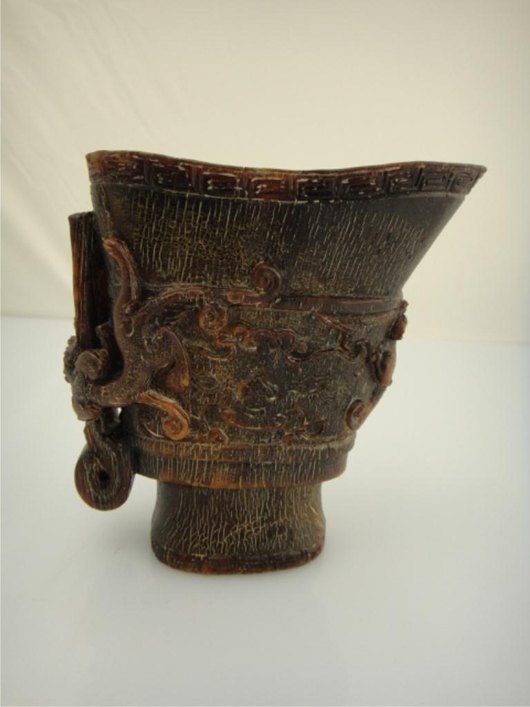 Chinese rhinoceros-horn carved libation cup, $4,400. 888 Auctions image.