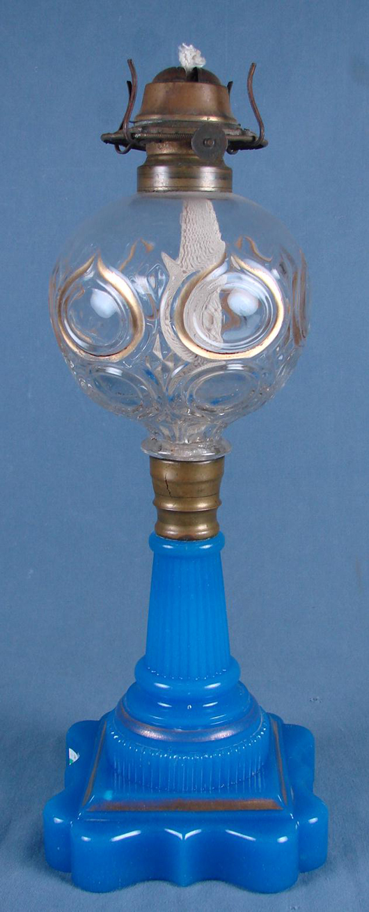 American blue opaline glass fluid lamp, possibly Sandwich, Flame Bull’s-Eye pattern, 13 inches. Est. 750-$1,500. Mapes Auctioneers image.