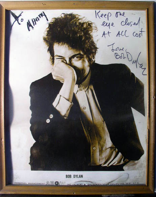 Bob Dylan photograph, 8 x 10 inches, autographed with the inscription: ‘Keep one eye closed at all cost.” Est. $4,000-$6,000. Guernsey’s image.