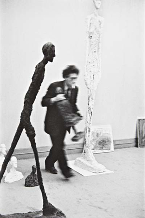 Henri Cartier-Bresson gelatin silver print of Alberto Giacometti and his sculptures, 1961. Image courtesy of LiveAuctioneers Archive and Phillips de Pury & Co.
