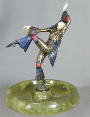 Enameled and silvered-bronze Gerdago Art Deco dancer with ivory face and hands, dished green alabaster base, 11 inches tall. William H. Bunch Auctions image.