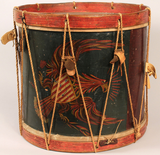 An early 19th-century folk art decorated drum with painted eagle, ex-Guthman, is estimated at $3,000-$3,500. Image courtesy Case Antiques Auction.