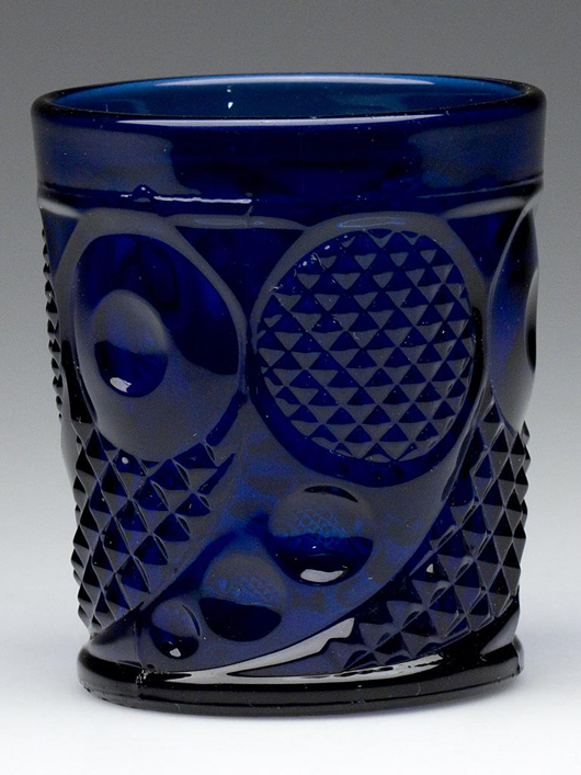 Horn of Plenty whiskey tumbler, cobalt blue, polished pontil mark. Boston & Sandwich Glass Co. and others. Previously unrecorded and possibly unique. No other forms in this pattern are known in cobalt blue. Estimate: $4,000-$6,000.