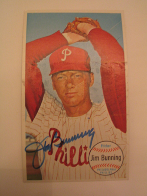 Jim Bunning, pictured in a 1964 Topps Giant baseball card, pitched a perfect game that season. The right-handed power pitcher won 224 games in 17 seasons in the majors. Image courtesy of LiveAuctioneers Archive and Hassinger & Courtney Auctioneering.