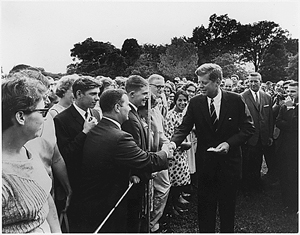 President John F. Kennedy greeting Peace Corps volunteers, Aug. 28, 1961. Abbie Rowe, photographer. Image courtesy of Wikimedia Commons.