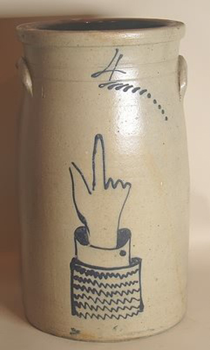 State legislators opposed to the Wisconsin law prohibiting margarine from being served in restaurants hope to vote on its repeal. The raised hand that decorates this salt-glazed stoneware churn appears to favor butter. Image courtesy of LiveAuctioneers Archive and Alderfer Auction & Appraisal.