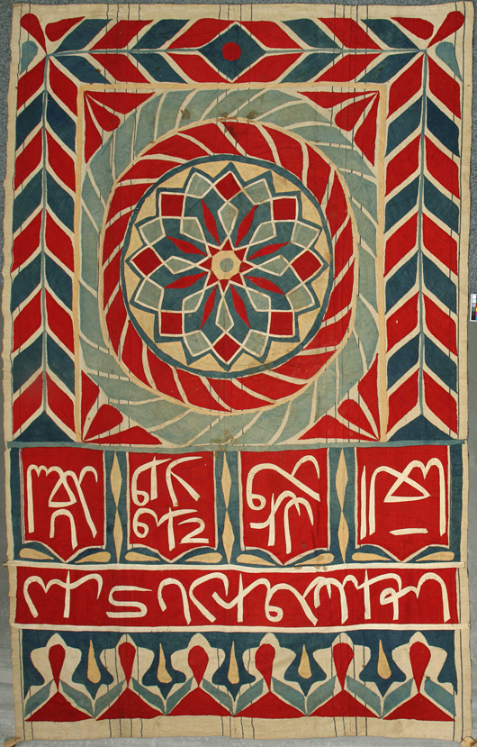 Rare four-panel North African Suzani, or wall-hanging, late 19th century / early 20th century, probably Egyptian, with arabic panels and a large roundel with star motif, 99 1/2 inches x 62 inches. Image courtesy of Mealy’s Fine Art.