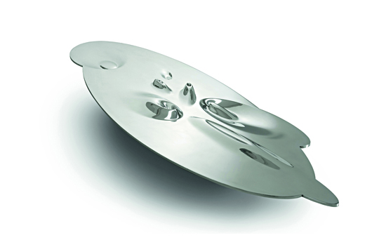 The polished aluminum Crater Table (2007) was made for David Gill Galleries, London, England. The work is part of a new exhibition designed by Zaha Hadid for the Philadelphia Museum of Art. Courtesy Philadelphia Museum of Art, photography Michael Molloy.