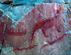 An example of a Native American pictograph, this panel with images of a canoe, Michipeshu (top right) and two serpents (below) is located at Agawa Rock, Lake Superior Provincial Park, Ontario, Canada. Photo taken July 26, 2011 by D. Gordon E. Robertson, licensed under the Creative Commons Attribution-Share Alike 3.0 Unported license.