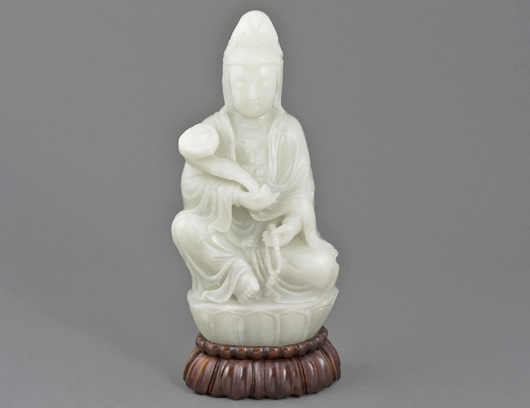 White jade figure of Buddha. Image courtesy of Auction Gallery of the Palm Beaches.