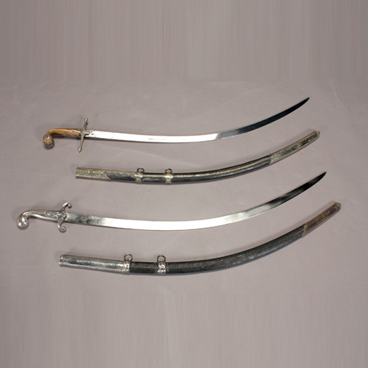 Two Middle-Eastern swords with scabbards. Sold for $7,200. Image courtesy of Michaan’s Auctions.