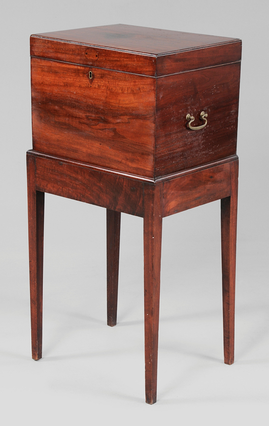 This early 19th century cellaret, 38 1/4 x 18 x 15 inches,” came from the Historic Orton Plantation in Wilmington, N.C. In figured walnut on its original tapered-leg stand, it sold for $36,000. Image courtesy of Brunk Auctions.
