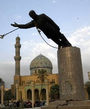 The statue of Saddam Hussein being toppled in Baghdad after the U.S. Invasion of Iraq. Image courtesy of Wikimedia Commons.