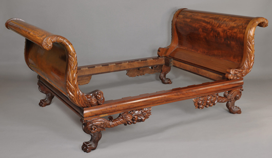 An American Classical carved sleigh bed from the A. Welling LaGrone Jr. estate achieved $9,976. Image courtesy of Case Antiques.