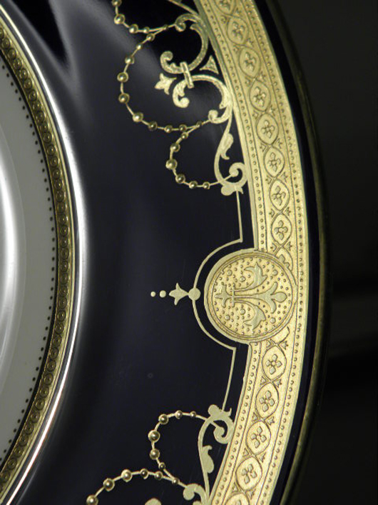 Detail showing cobalt and raised gilt pattern on a set of 12 plates, which are marked ‘Mintons Tiffany & Co, New York Made in England’ and ‘g.9180.’ Estimate: $900-$1,200. Image courtesy of Auctions Neapolitan. 