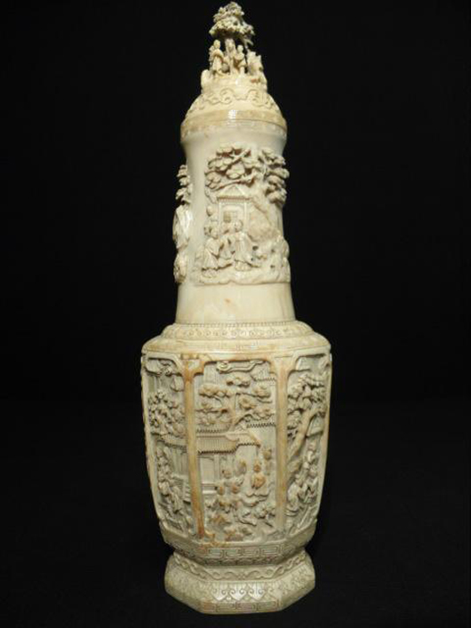Exceptionally detailed scenes adorn this early 20th century Chinese urn of carved elephant ivory. It is 16 inches tall and approximately 5 inches wide. Estimate: $3,000-$4,000. Image courtesy of Auctions Neapolitan.