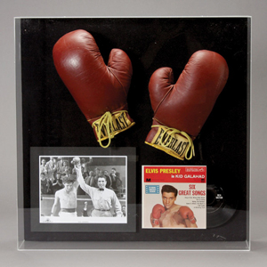 'Kid Galahad' boxing gloves with photo and Elvis Presley record. Estimate: $10,000/$12,000. Image courtesy Michaan's Auctions.