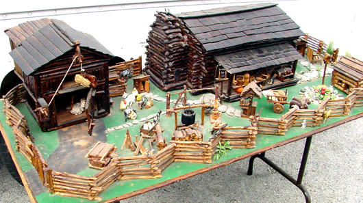 Handmade tableau consisting of a farmhouse, two-story barn, outbuildings, split-rail fence and dozens of miniature accessories. John W. Coker Auctions image.