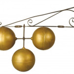 The traditional pawnbroker sign consisting of three suspended gold globes. Image courtesy of LiveAuctioneers.com and Showtime Auction Services.