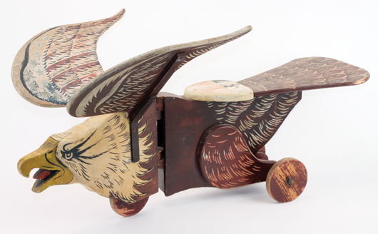 American Eagle painted wood riding toy with outstretched wings, made by S.A. Smith Co., Brattleboro, Vt., 39 inches long, est. $3,000-$4,000. Noel Barrett Auctions image.