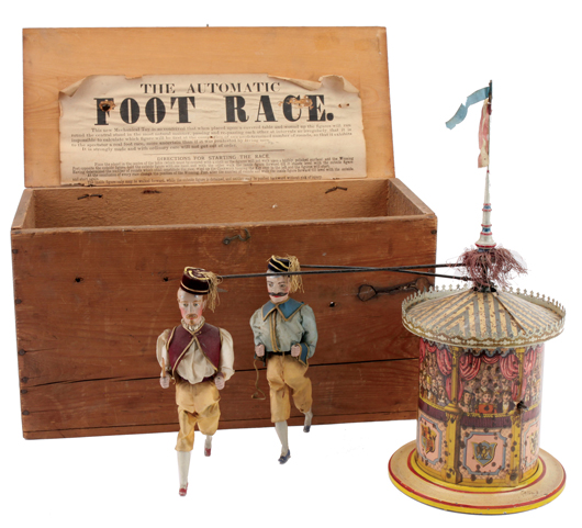 The Automatic Foot Race, 1880s, William Britain & Sons (England), featuring two cloth-dressed figures that trot around a paper-litho metal cylinder, est. $5,000-$12,000. Noel Barrett Auctions image.