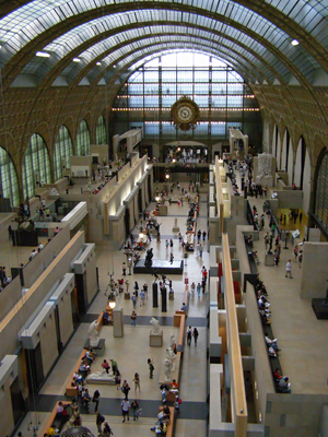 A gallery at the Orsay Museum, which is housed in a former Paris railway station. Image courtesy of Wikimedia Commons.