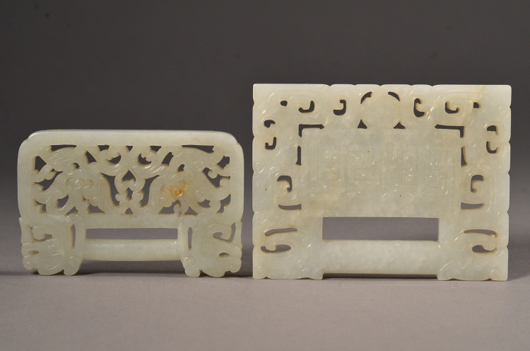 The pair of Chinese white Hetian jade belt buckles, finely incised and openwork carved sold for $1,694, two times its high estimate. Image courtesy of 888 Auctions.