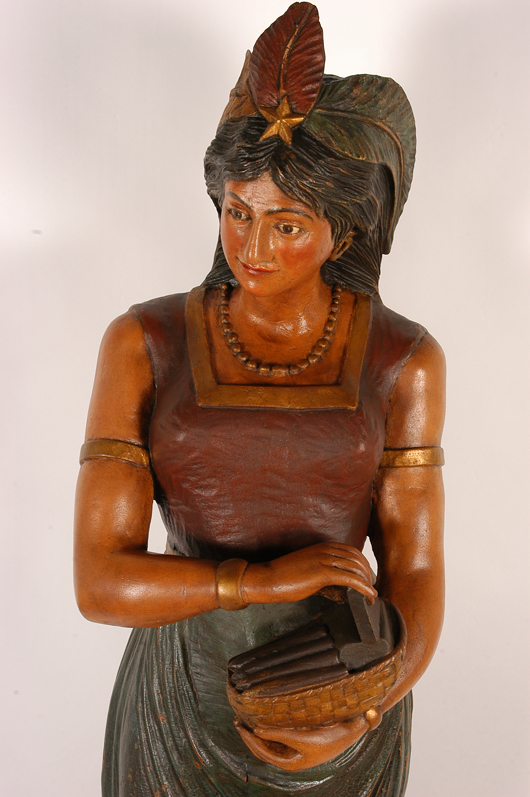 J. Engle, well-carved and polychromed wood, circa 1895, Cuban girl tobacconist figure. Image courtesy of Slotin Folk Art.