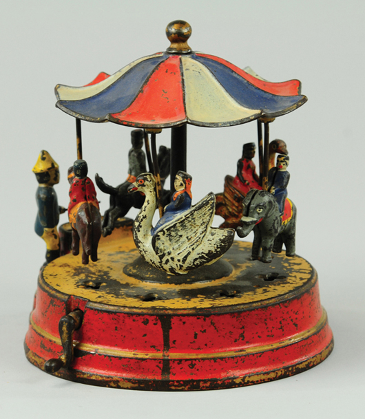 Circa-1885 Kyser & Rex ‘Merry Go Round’ cast-iron mechanical bank, est. $10,000-$12,000. Bertoia Auctions image.