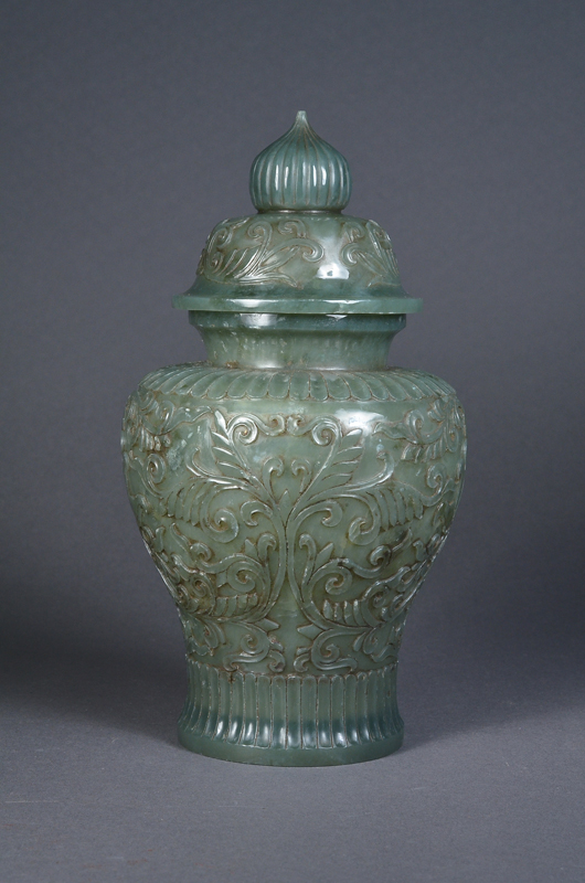 Exquisitely carved and exceptionally hollowed, 18th-century Chinese translucent spinach green jade baluster vase, 19 cm (7 1/2 inches) high. Image courtesy of 888 Auctions.